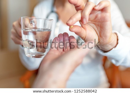 Pensioner gets a glass of water