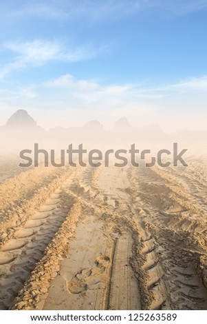 wheel tracks on sand