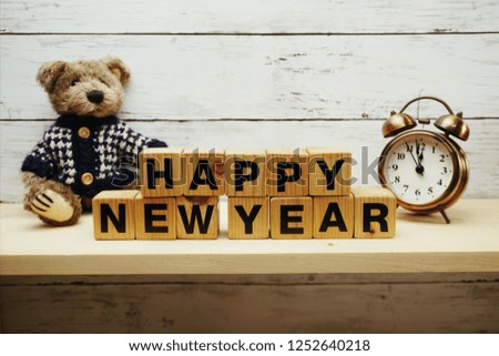 happy new year alphabet letters on wooden background