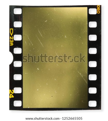 Old fashioned 35 mm filmstrip or dia slide frame isolated on white background. Real analog film scan with signs of usage. Empty or blank movie screen