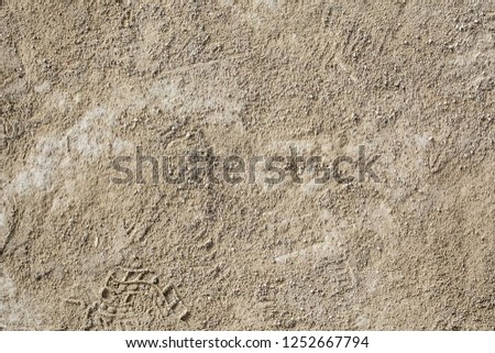 Photo of a ground sand texture for background.
