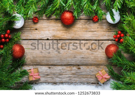 Christmas background, gifts and ornaments on old wooden table