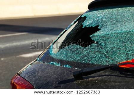 A close up of a damaged car window