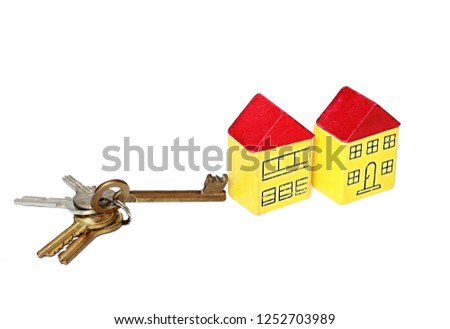 property purchase representing with miniature toy block houses with keys on table white background no people stock photo