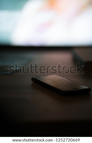 Used phone on the TV table