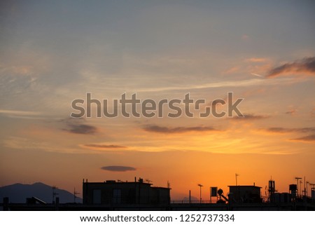 Beautiful sunset sky. Sun, sunset, sunrise. Colorful toned instant photo. Fiery orange sunset sky. Beautiful sky. Sunset / sunrise with clouds, light rays and other atmospheric effect