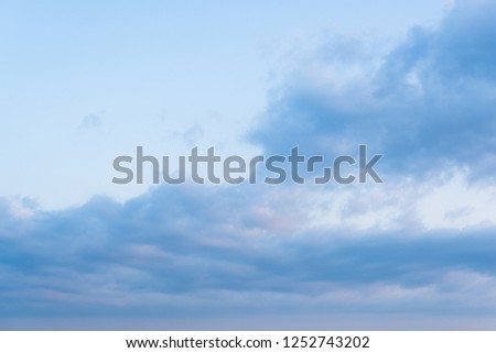 Blue sky with blue and pink clouds