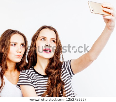two best friends teenage girls together having fun, posing emotional on white background, besties happy smiling, making selfie, lifestyle people concept 