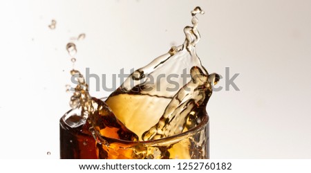 cola splash, there is some movement in the splashes close up