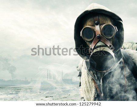 Environmental disaster. Post apocalyptic survivor in gas mask Royalty-Free Stock Photo #125279942