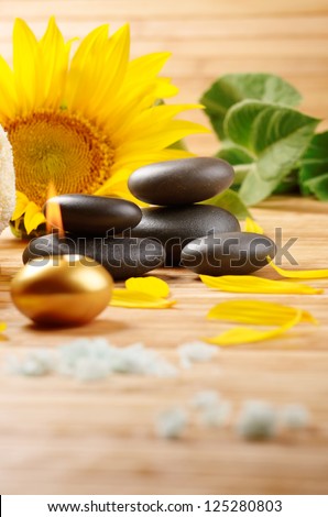 Sunflower spa set on the wooden table with copy-space