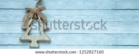 Close-up. Wooden Christmas spruce on a wooden background, top view