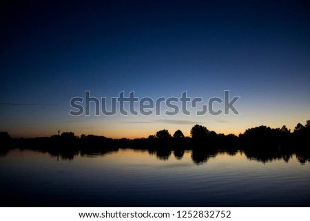Sunrise over calm lake