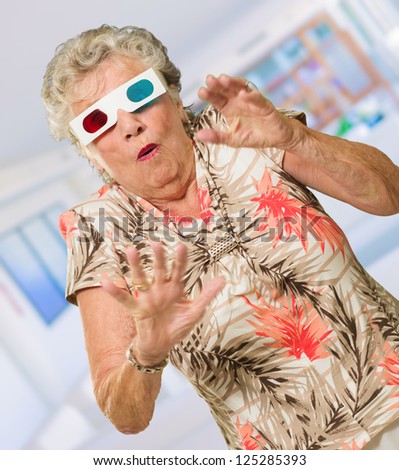 Afraid Senior Woman Watching 3d Movie, Indoors