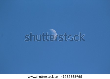 Half moon shadow with clear blue sky during the day