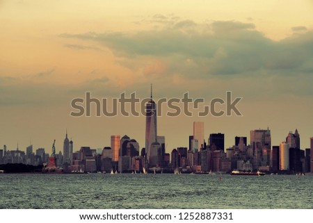Manhattan downtown skyline with urban skyscrapers over river.