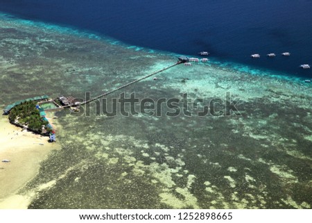 A view from the sky of Nalusuan Island in Cebu, Philippines. Royalty-Free Stock Photo #1252898665