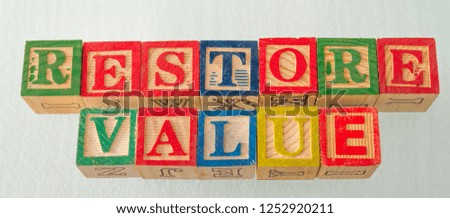 The term restore value visually displayed on a white background using colorful wooden blocks image in landscape format