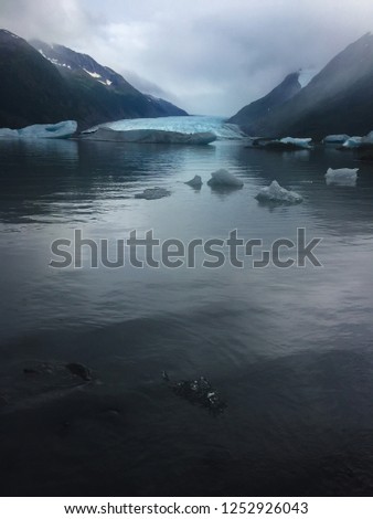 Icebergs near the glacier. Royalty-Free Stock Photo #1252926043