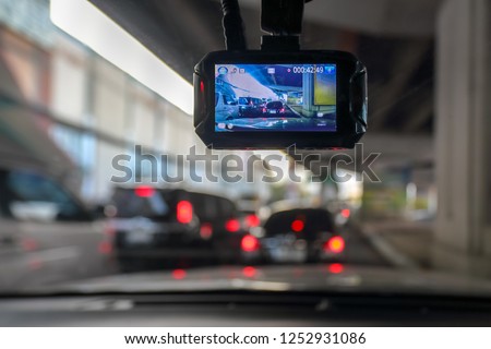 Dash Camera or car video recorder in vehicle on the way Royalty-Free Stock Photo #1252931086