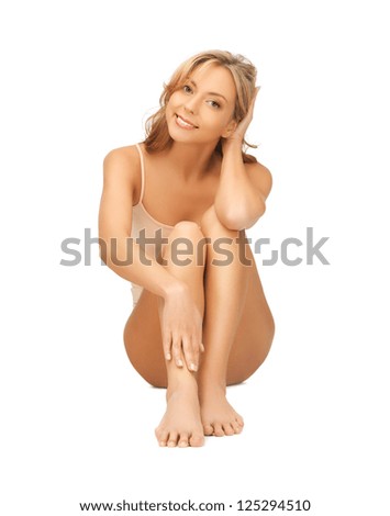 picture of beautiful woman in cotton undrewear touching her legs