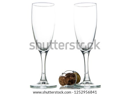 Pouring champagne into two glasses