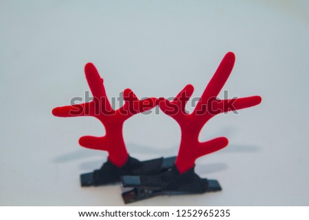 Red antler shape fashion hair accessory. It is a symbol of Santa Claus in the Christmas season that is popular all over the world that changes with the eras and eras.