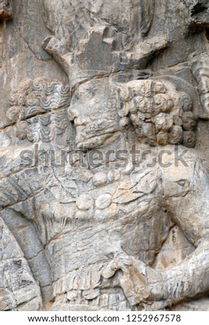Sassanian stone reliefs in Naqsh-e Rostam (rock tombs of ancient iranian kings Darius III, Artaxerxes I, Darius I and Xerxes I). Iran