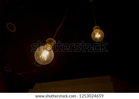 light bulb in the dark , place for text