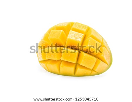 Mango exotic friut cut in half cubes isolated on white background. Clipping Path. Full depth of field.