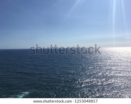 Clear blue sky and sunshine ocean