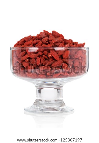 Goji berries in a glass bowl isolated on white