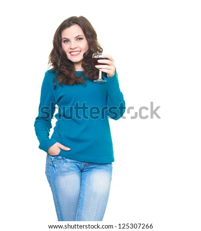Happy young woman in a blue shirt holding a glass of wine. Isolated on white background