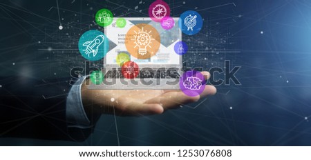 View of a Businessman holding a Cloud of colorfull start up icon bubble with a laptop 3d rendering