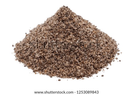 Heap of ground black peppercorn isolated on white background