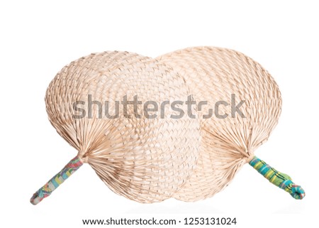 Picture of weave fan make of plant that is general product in Thailand isolated on white background