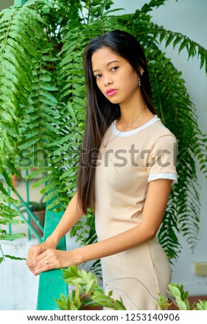 Beautiful woman posing - standing in the balcony