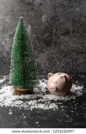 Picture of piggy, artificial Christmas tree, snow