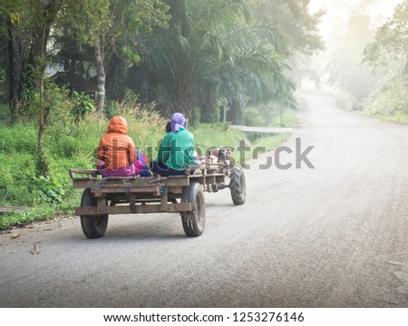 Thai Villagers Riding Vintage Truck In Foggy Day