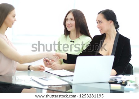 handshake of business partners at your Desk.woman and business