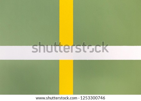sports background : white and yellow marking lines on an indoor sports floor