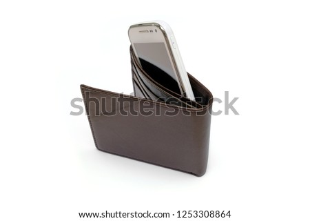Pay with your phone - a smartphone in an empty wallet, isolated on white background. Concept for e-wallet, cashless payment via mobile app, electronic shopping (eshopping) or modern payment method.