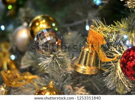 Christmas bells and Christmas ball hanging on Christmas tree, Christmas and New Year holidays background 