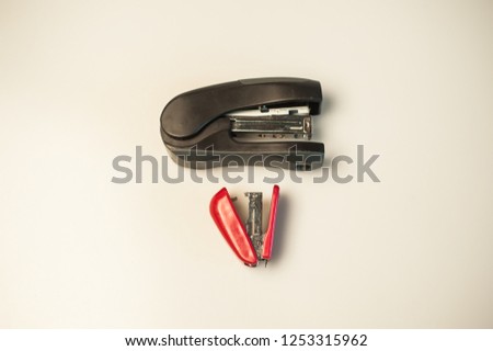 Black I and red isolated staplers