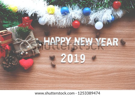 Happy New Year 2019, and free space for text on wooden background. Christmas decorations, Christmas toys, gifts.