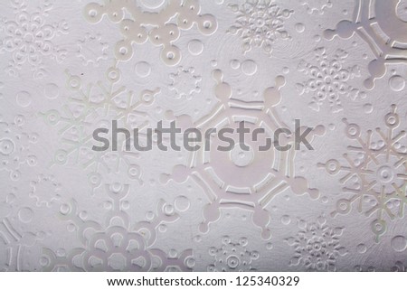 texture of white paper with a textured snowflakes for card