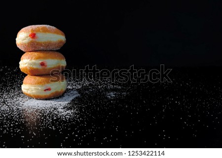 Jelly filled doughnuts with powdered sugar