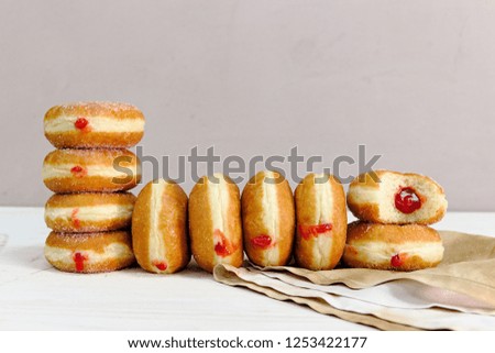 Jelly filled doughnuts with powdered sugar