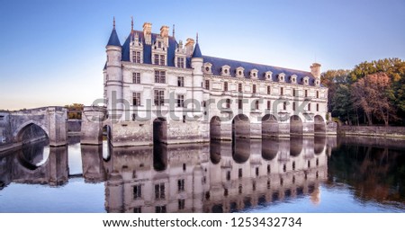 Chateau de Chenonceau in Loire Valley, France. This Renaissance castle is famous landmarks in France. Panoramic view of old nice palace, blue sky and water. Scenery of French mansion at river.
