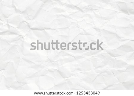 The background is white with an old surface, with cracks and kinks. Texture of paper in retro style, crumple. Royalty-Free Stock Photo #1253433049